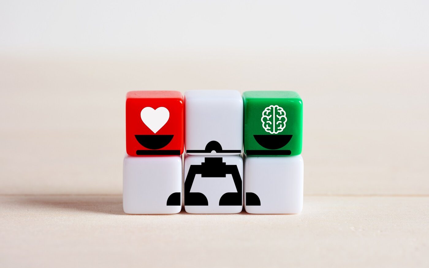 ©Cagkan Sayin / Shutterstock Blocks showing a scale that balances a heart on one side and a brain on the other