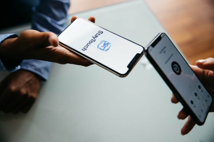 Two people using the StayTouch mobile application to connect after a meeting.