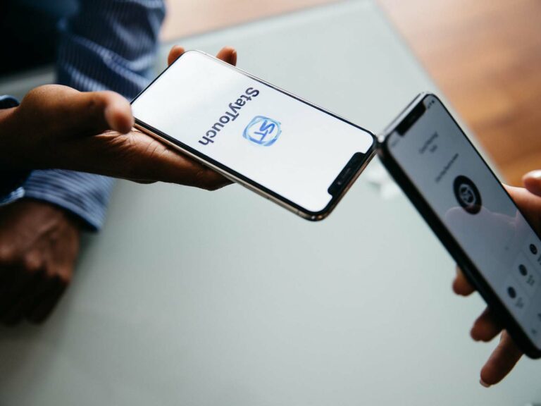 Two people using the StayTouch mobile application to connect after a meeting.