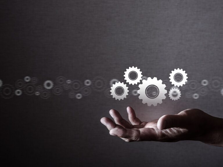 Human manipulating gears, technology.