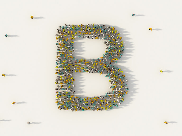 Large group of people forming letter B