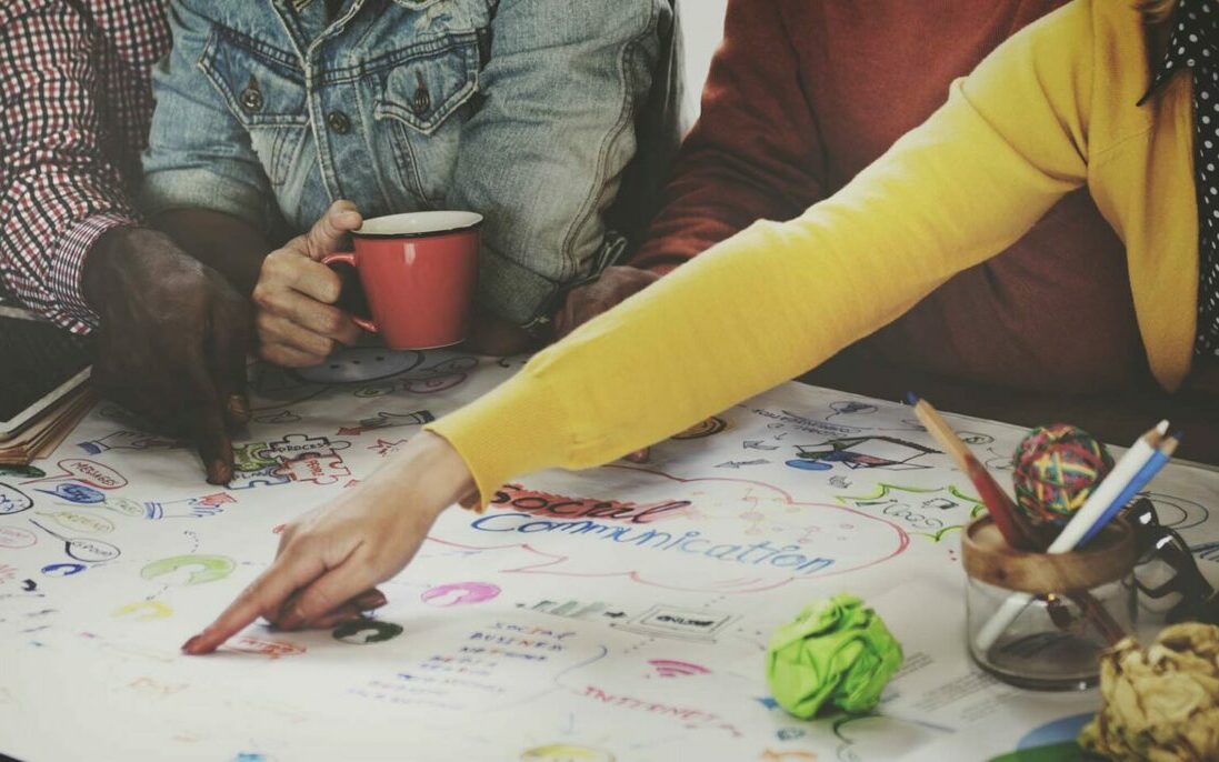 Photo by Rawpixel/AdobeStock Business team working together on creative concept