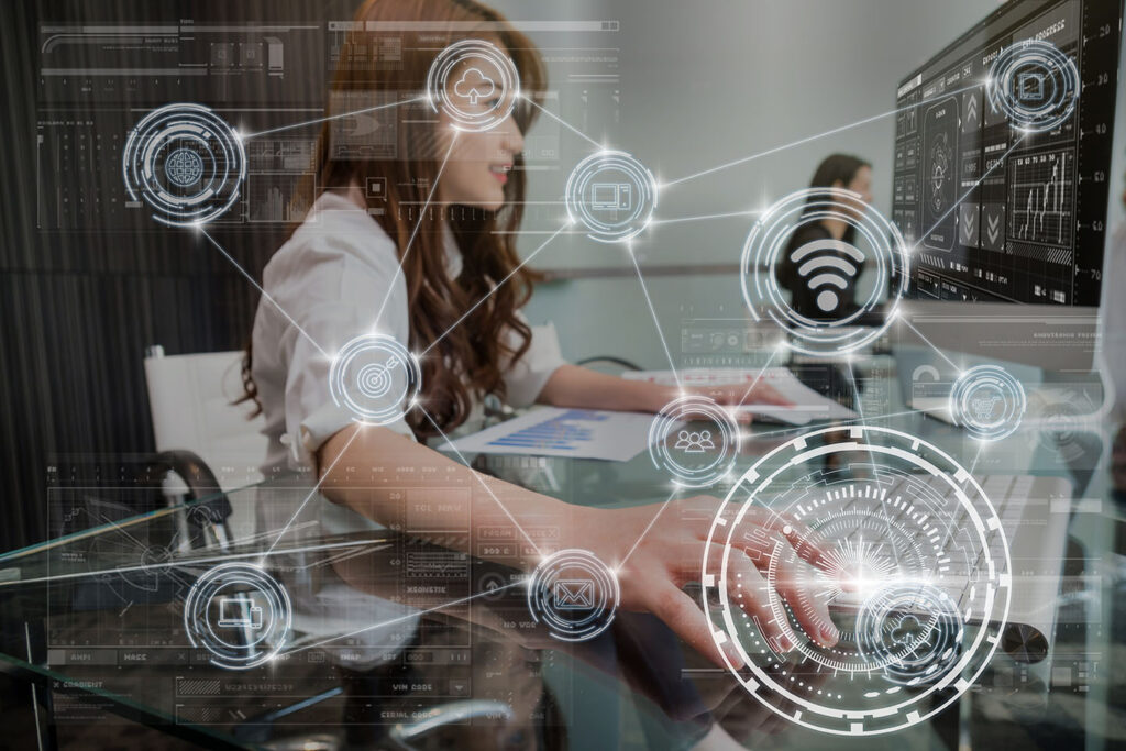 technology digital virtual screen and Wireless communication connecting over the hand young asian business woman pressing the keyboard of computer in modern Office, business internet of thing