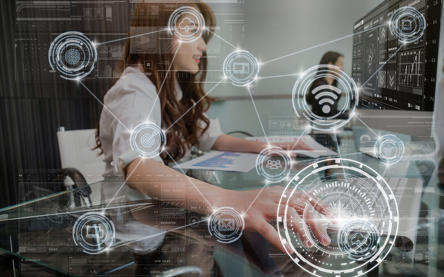 ©Thananit/Adobe Stock technology digital virtual screen and Wireless communication connecting over the hand young asian business woman pressing the keyboard of computer in modern Office, business internet of thing