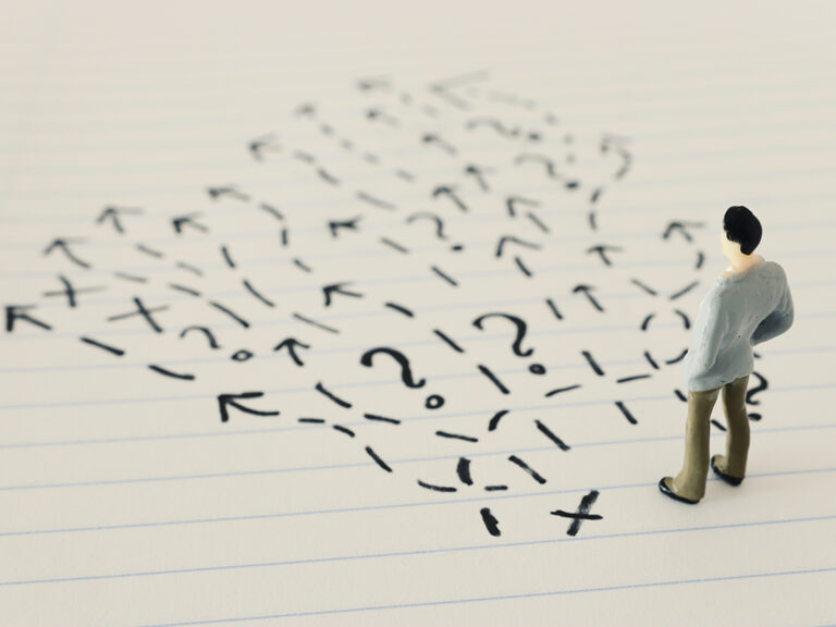 A businessman thinking about the best way to solve a problem.