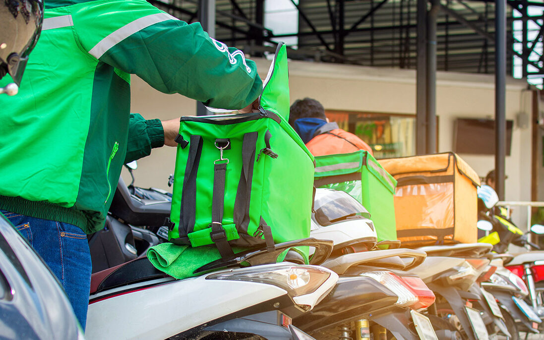 wittaya-AdobeStock Food delivery drivers preparing the product.