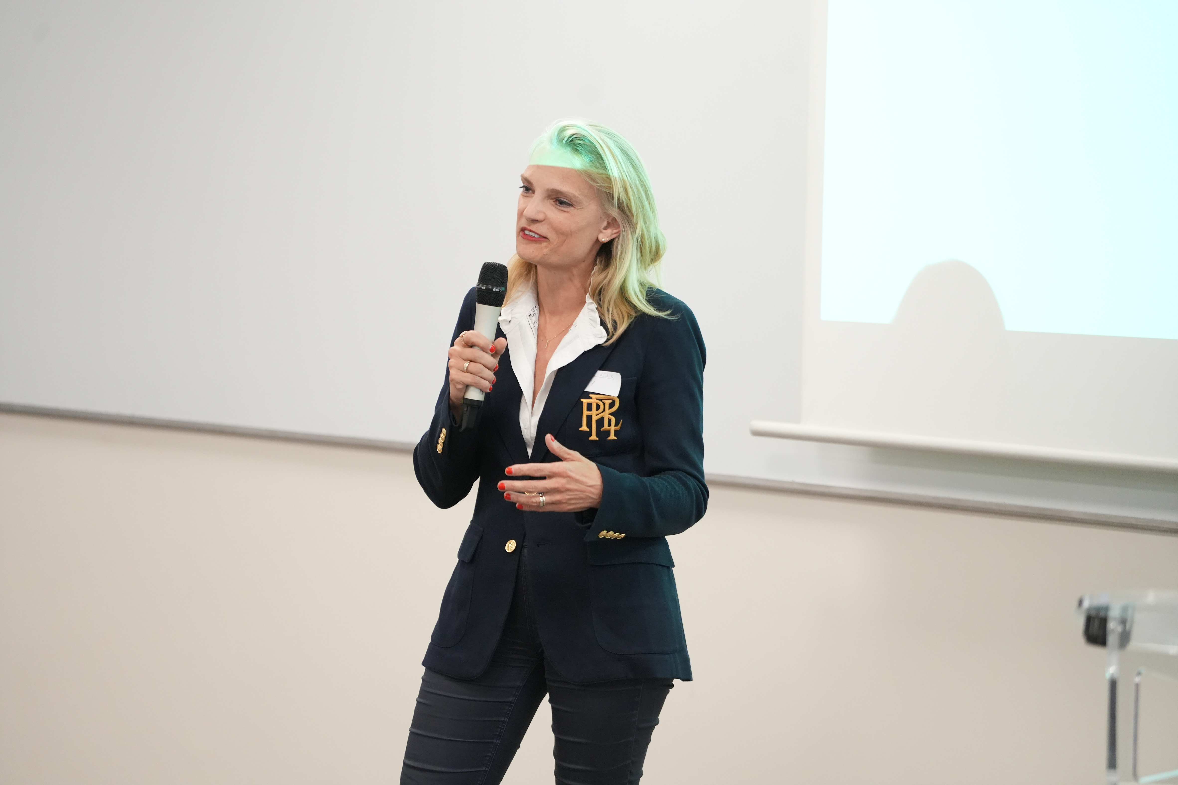 Photo of Fabienne Konik presenting the women in finance association